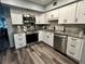 Updated kitchen with stainless steel appliances and modern white cabinets at 2020 World Parkway Blvd # 14, Clearwater, FL 33763