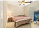 Cozy bedroom with a ceiling fan, closet, and natural light at 20251 Ravens End Dr, Tampa, FL 33647