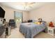 Bedroom with a ceiling fan, window, and carpeting at 20251 Ravens End Dr, Tampa, FL 33647