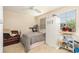 Bedroom with a single bed, leather chair, and ample storage at 20251 Ravens End Dr, Tampa, FL 33647