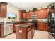 Modern kitchen featuring granite countertops, stainless steel appliances, and tile backsplash at 20251 Ravens End Dr, Tampa, FL 33647