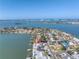 Aerial view of waterfront home with a pool and a dock, with views of the bay at 2140 Dolphin S Blvd, St Petersburg, FL 33707