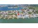 Aerial view of waterfront homes, each featuring a private pool and dock at 2140 Dolphin S Blvd, St Petersburg, FL 33707