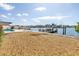 Beautiful backyard features a waterfront view and dock, with a small area covered with pebbles at 2140 Dolphin S Blvd, St Petersburg, FL 33707