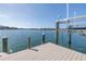 An updated private boat dock with a boat lift, offering picturesque waterfront views at 2140 Dolphin S Blvd, St Petersburg, FL 33707