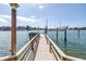 Exterior view of an updated private dock with a boat lift and picturesque waterfront views at 2140 Dolphin S Blvd, St Petersburg, FL 33707