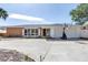 Charming single-story home with a brick facade, bright white trim, and a spacious two car garage at 2140 Dolphin S Blvd, St Petersburg, FL 33707