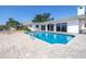 Sparkling pool in backyard with patio and waterfront views, perfect for relaxation and entertaining at 2140 Dolphin S Blvd, St Petersburg, FL 33707