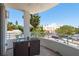 This inviting balcony includes a table set and charming views of the city at 231 2Nd S St # 201, Safety Harbor, FL 34695