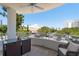 Relaxing balcony features a seating area and views of surrounding buildings and landscape at 231 2Nd S St # 201, Safety Harbor, FL 34695