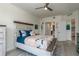 Comfortable bedroom showcasing a stylish bed, accent pillows, and neutral decor at 231 2Nd S St # 201, Safety Harbor, FL 34695