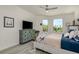 Inviting bedroom featuring light-colored wood floors, TV, and large windows that provide ample natural light at 231 2Nd S St # 201, Safety Harbor, FL 34695