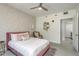 Comfortable bedroom featuring unique wallpaper and a plush pink bed, creating a modern and inviting space at 231 2Nd S St # 201, Safety Harbor, FL 34695