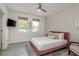Stylish bedroom featuring unique geometric wall art and a plush pink bed, creating a modern and inviting space at 231 2Nd S St # 201, Safety Harbor, FL 34695