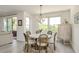 Charming dining room with a round table set, chandelier, and natural light at 231 2Nd S St # 201, Safety Harbor, FL 34695