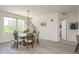 Inviting dining area with a round table, chandelier, and view of the outdoors at 231 2Nd S St # 201, Safety Harbor, FL 34695