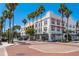 Charming multi-story building featuring awnings, street parking, and inviting street-side dining at 231 2Nd S St # 201, Safety Harbor, FL 34695
