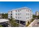 Well-maintained condo building showcasing balconies and covered parking for residents and guests at 231 2Nd S St # 201, Safety Harbor, FL 34695