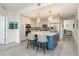 Bright, open kitchen with island seating, modern appliances, and ample cabinet space at 231 2Nd S St # 201, Safety Harbor, FL 34695