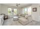 Comfortable living room features a sectional sofa, stylish coffee table, and bright windows at 231 2Nd S St # 201, Safety Harbor, FL 34695