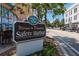 Welcome to Downtown Safety Harbor sign on a picturesque street at 231 2Nd S St # 201, Safety Harbor, FL 34695