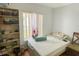 Inviting bedroom featuring natural light, window and hardwood floors at 2643 Pine Ridge S Way # A1, Palm Harbor, FL 34684