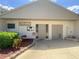 Community clubhouse entrance with well-kept landscaping, signage, and easy access for residents at 2643 Pine Ridge S Way # A1, Palm Harbor, FL 34684