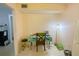 Bright dining area featuring a small table, chair, and tile flooring; functional and cozy at 2643 Pine Ridge S Way # A1, Palm Harbor, FL 34684