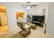 Comfortable living room with tile flooring, ceiling fan, and a view into the adjacent kitchen at 2643 Pine Ridge S Way # A1, Palm Harbor, FL 34684