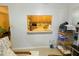 Bright view from living room through to the kitchen; built-in bar and shelving at 2643 Pine Ridge S Way # A1, Palm Harbor, FL 34684