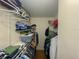 Spacious walk-in closet with ample shelving and hanging space for organized storage at 2643 Pine Ridge S Way # A1, Palm Harbor, FL 34684