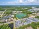 Overhead perspective highlighting the pond, lush greenery, and surrounding neighborhood at 311 Vista Cruiser Ln, Oldsmar, FL 34677