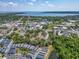 Aerial view of a coastal community with views of the bay, greenery and pond at 311 Vista Cruiser Ln, Oldsmar, FL 34677
