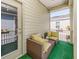 Cozy balcony with outdoor seating, greenery, and string lights for a relaxing ambiance at 311 Vista Cruiser Ln, Oldsmar, FL 34677