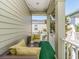 Relaxing balcony space with comfortable seating and views of the surrounding neighborhood at 311 Vista Cruiser Ln, Oldsmar, FL 34677