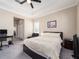 Bright bedroom features neutral walls, large bed with ceiling fan, plus an adjacent sitting area at 311 Vista Cruiser Ln, Oldsmar, FL 34677