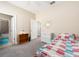 Cozy bedroom features access to an en-suite bath and nice closet space at 311 Vista Cruiser Ln, Oldsmar, FL 34677