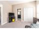 Bedroom with neutral walls, a large closet, and an ensuite bathroom at 311 Vista Cruiser Ln, Oldsmar, FL 34677