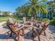 Outdoor fire pit with Adirondack chairs, creating a cozy community gathering space at 311 Vista Cruiser Ln, Oldsmar, FL 34677