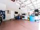 Spacious garage with ample storage space and a sealed epoxy floor at 311 Vista Cruiser Ln, Oldsmar, FL 34677