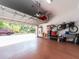 Garage with an open door and storage racks at 311 Vista Cruiser Ln, Oldsmar, FL 34677