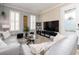 Stylish living room with neutral tones, modern furnishings, and ample natural light at 311 Vista Cruiser Ln, Oldsmar, FL 34677