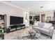 Open-concept living room flowing into a modern kitchen and dining area, perfect for entertaining at 311 Vista Cruiser Ln, Oldsmar, FL 34677