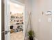 Walk-in pantry featuring lots of shelving, storage for groceries and a tiled floor at 311 Vista Cruiser Ln, Oldsmar, FL 34677