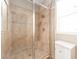 Close-up of a glass-enclosed shower with tiled walls, built-in seat, and a shower caddy at 311 Vista Cruiser Ln, Oldsmar, FL 34677