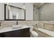 Modern bathroom with frameless glass shower, soaking tub, and marble vanity at 3111 W De Leon St # 8, Tampa, FL 33609