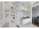 Luxurious bathroom with marble and glass enclosed shower with dual shower heads, and vessel sinks at 3111 W De Leon St # 8, Tampa, FL 33609