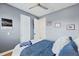 Comfortable bedroom features hardwood floors and plantation shutters at 3111 W De Leon St # 8, Tampa, FL 33609
