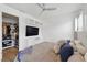 Bedroom features a ceiling fan, built in entertainment center and access to walk-in closet at 3111 W De Leon St # 8, Tampa, FL 33609