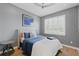 Comfortable bedroom with hardwood floors, neutral walls, and plantation shutters at 3111 W De Leon St # 8, Tampa, FL 33609